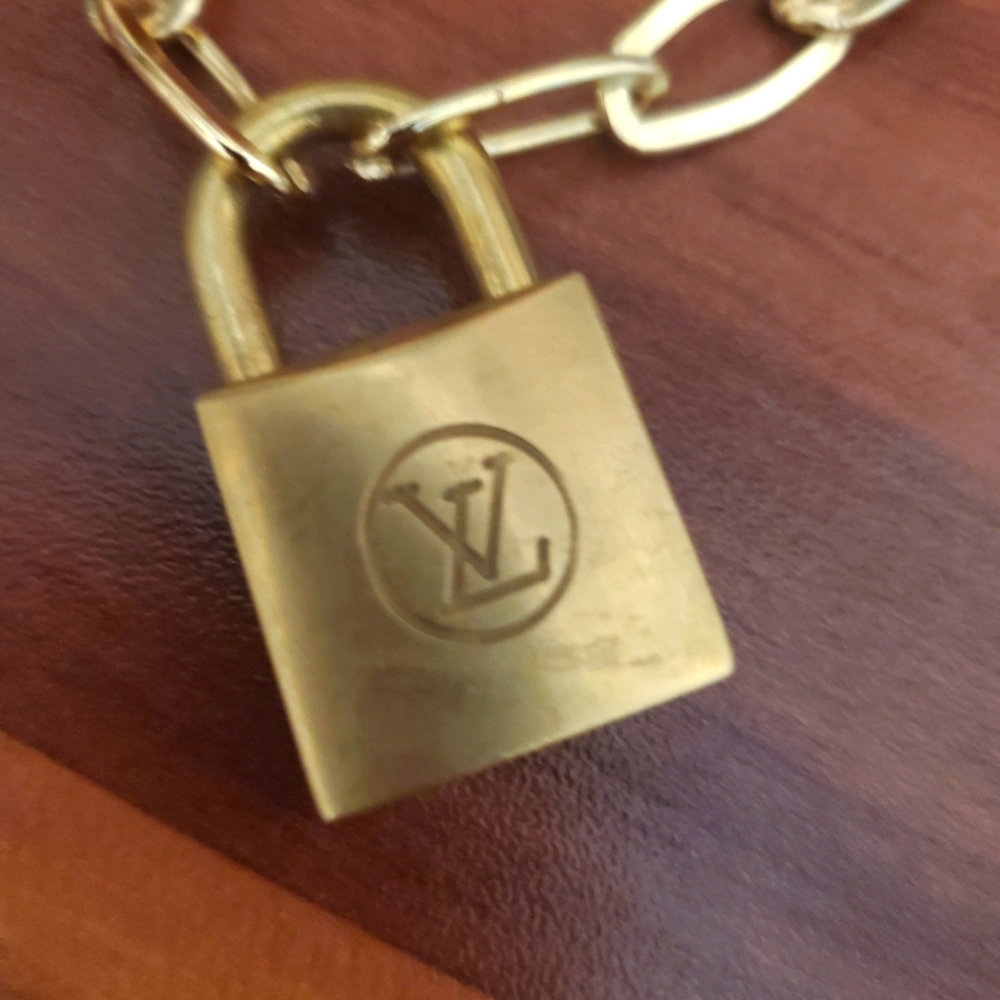 Louis Vuitton Lock with gold link chain